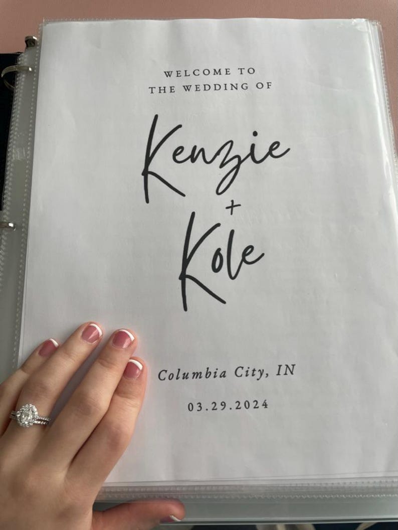 May include: A white wedding program with black text. The text reads "Welcome to the wedding of Kenzie + Kole, Columbia City, IN 03.29.2024".
