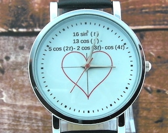 Het polshorloge van de hartvergelijking. Schattig concept horloge. Wordt geleverd met zwarte leren riem en witte doos