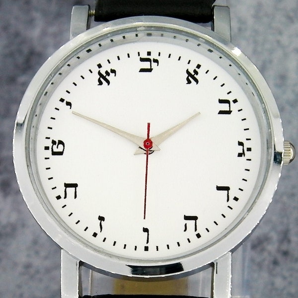 Hebrew numerals custom wristwatch. Minimalist/understated design. Comes with black strap. Unique watch design. White face