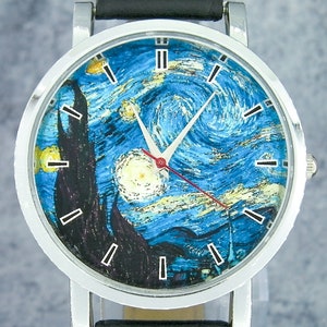 May include: A silver wristwatch with a black leather band. The watch face features a reproduction of Vincent van Gogh's "The Starry Night" painting.