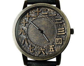 3d Japanese Kanji numerals design, gold wax finish, handmade wristwatch. Black strap. Unisex