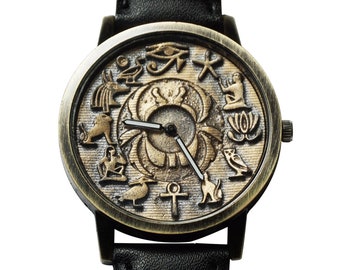 3d Egyptian hieroglyphs writing design, gold numerals & rustic background, handmade wristwatch. Black strap. Unisex