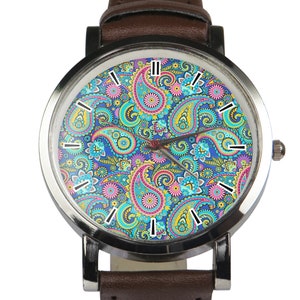 May include: A brown leather wristwatch with a silver case and a colourful paisley pattern on the face.