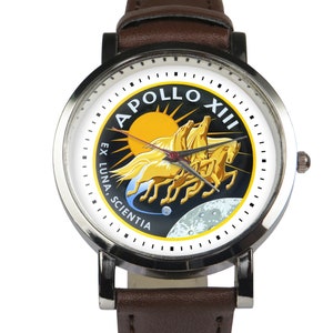 Apollo 13 moon landing insignia wristwatch. Black or brown strap