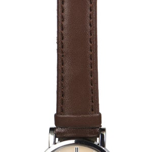 May include: A silver wristwatch with a brown leather band. The watch face features a colorful image of "The Great Wave off Kanagawa" by Katsushika Hokusai.