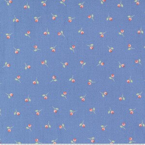 May include: A blue fabric with a repeating pattern of small pink flowers with green stems. The fabric is marked with a ruler and the words "moda" and "www.modafabrics.com".