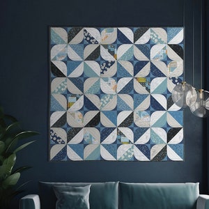 May include: A blue and white quilt with a geometric pattern of overlapping circles. The quilt is hanging on a dark blue wall above a teal couch. The text "ZEN CHIC" and "LOTUS" is visible in the image.