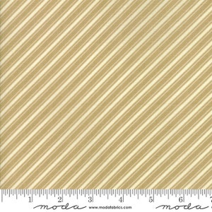 May include: Beige fabric with thin white diagonal stripes. The fabric is measured with a ruler in inches.