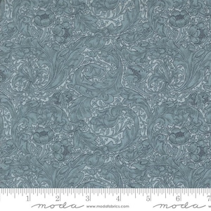 May include: A blue and white floral fabric with a repeating pattern of stylized leaves and flowers. The fabric is printed with a subtle texture and has a vintage aesthetic.