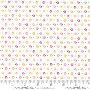 May include: White fabric with a repeating pattern of small pink, orange, and green flowers. The fabric has a ruler with inches marked on it and the text "moda" at the bottom.