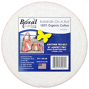 May include: A roll of white Katahdin On-A-Roll 100% Organic Cotton interfacing by Bosal. The label features a yellow butterfly and images of colorful fabric bags. The roll measures 2.5 inches by 25 yards.