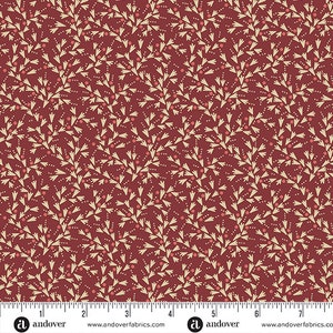 May include: A red fabric with a repeating pattern of cream-colored stylized branches with small red dots. The fabric has a ruler with the text "Andover" printed on it.