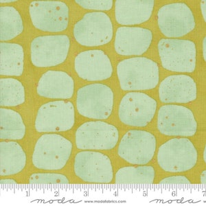May include: A green and gold fabric with a repeating pattern of rounded shapes. The fabric has a subtle shimmer.