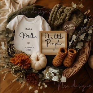 May include: A baby announcement featuring a white onesie with the name "Miller" and the date "October 2026". The announcement includes a letter board that says "Our little Pumpkin", a small white pumpkin, and a pair of knitted baby booties.
