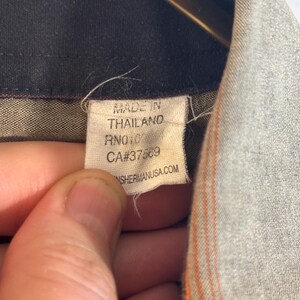 May include: A white tag with black text that reads "Made in Thailand RN#101123 CA#37583 SHERMANUSA.COM".