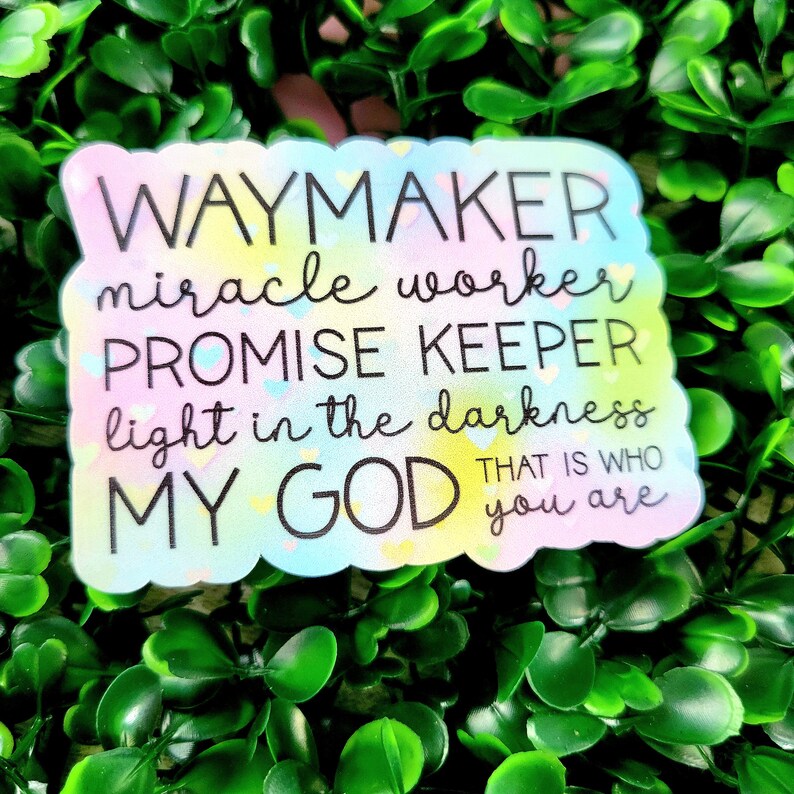 May include: A colourful sticker with the text "WAYMAKER miracle worker PROMISE KEEPER light in the darkness MY GOD THAT IS WHO you are".