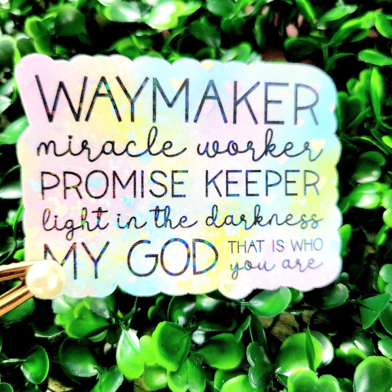 May include: A colourful sticker with a holographic finish featuring the text "WAYMAKER miracle worker PROMISE KEEPER light in the darkness MY GOD THAT IS WHO you are".