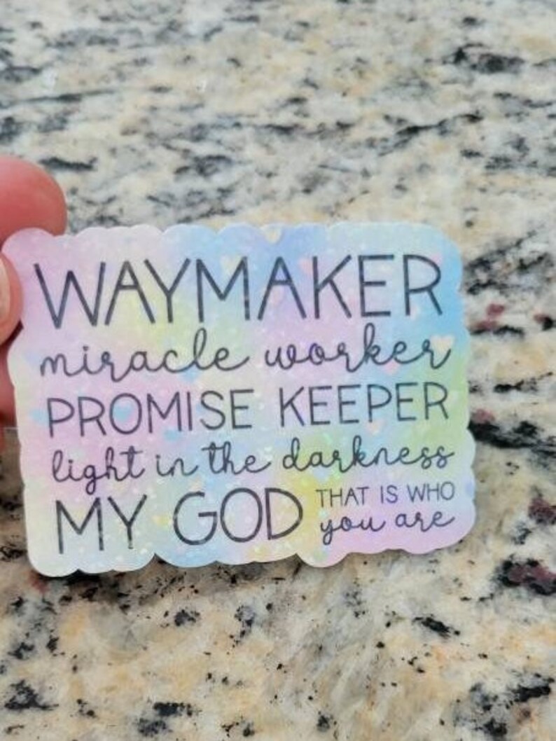 May include: A colourful sticker with the text "Waymaker, miracle worker, promise keeper, light in the darkness, my God that is who you are".