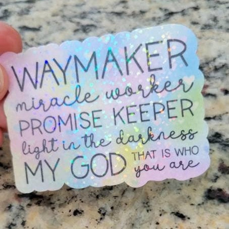 May include: A rainbow iridescent sticker with the text "Waymaker, miracle worker, promise keeper, light in the darkness, my God that is who you are".