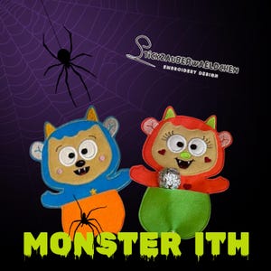 May include: Two embroidered monster figures with blue and orange, and red and green color schemes. The figures have large eyes and are holding a wrapped candy. The text "MONSTER ITH" is displayed in green, with a spider and web in the background.