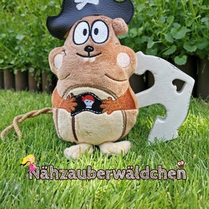 May include: A brown plush toy pirate with a black hat and a white skull and crossbones design. The toy is holding a small white sword and has a brown tail.