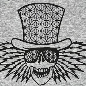 May include: Black and white illustration of a skull wearing a top hat with a geometric pattern. The skull is wearing sunglasses with the same geometric pattern. The skull has a large, toothy grin.