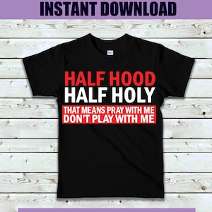 May include: Black t-shirt with white text that reads "HALF HOOD HALF HOLY THAT MEANS PRAY WITH ME DON'T PLAY WITH ME" in red.