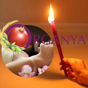May include: A lit red ear candle held by a hand, with the word "ORGANYA" in purple. A circular graphic features a pomegranate, wheat, and leaves. Pink flower petals are scattered near a person's ear.