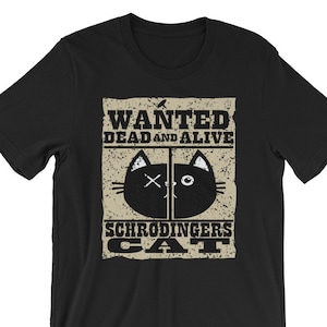 May include: Black t-shirt with a vintage-style wanted poster design featuring a black cat with a white X over one eye and a white circle for the other eye. The poster reads "WANTED DEAD AND ALIVE SCHRODINGER'S CAT".