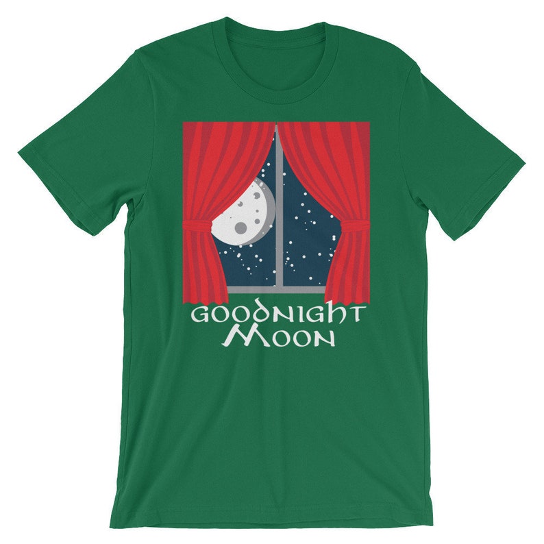 May include: Green t-shirt with a red window with white curtains and a moon in the night sky. The text "Goodnight Moon" is printed below the window.