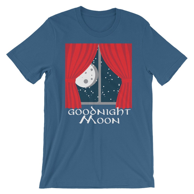 May include: A blue t-shirt with a red window with white curtains and a moon and stars in the window. The text "Goodnight Moon" is printed below the window.