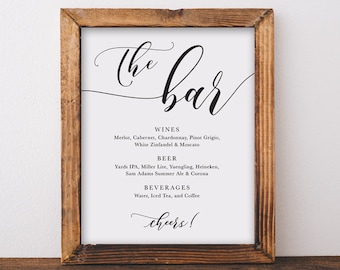 May include: A framed sign with the text "The Bar" in a cursive font. The sign lists a variety of wine, beer, and beverage options. The text "Cheers!" is at the bottom of the sign.