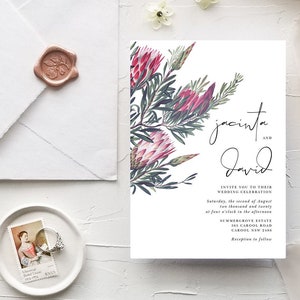 May include: Wedding invitation with a floral design featuring pink protea flowers and green leaves. The invitation reads "Jacinta and David invite you to their wedding celebration Saturday, the second of August two thousand and twenty at four o'clock in the afternoon Summergrove Estate 563 Carool Road Carool NSW 2186 Reception to follow."