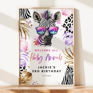 May include: A framed poster featuring a zebra wearing sunglasses with a rainbow design. The poster has the text "WELCOME ALL Party Animals" and "JACKIE'S 3RD BIRTHDAY 20 OCTOBER". The design includes watercolor splashes and floral elements.