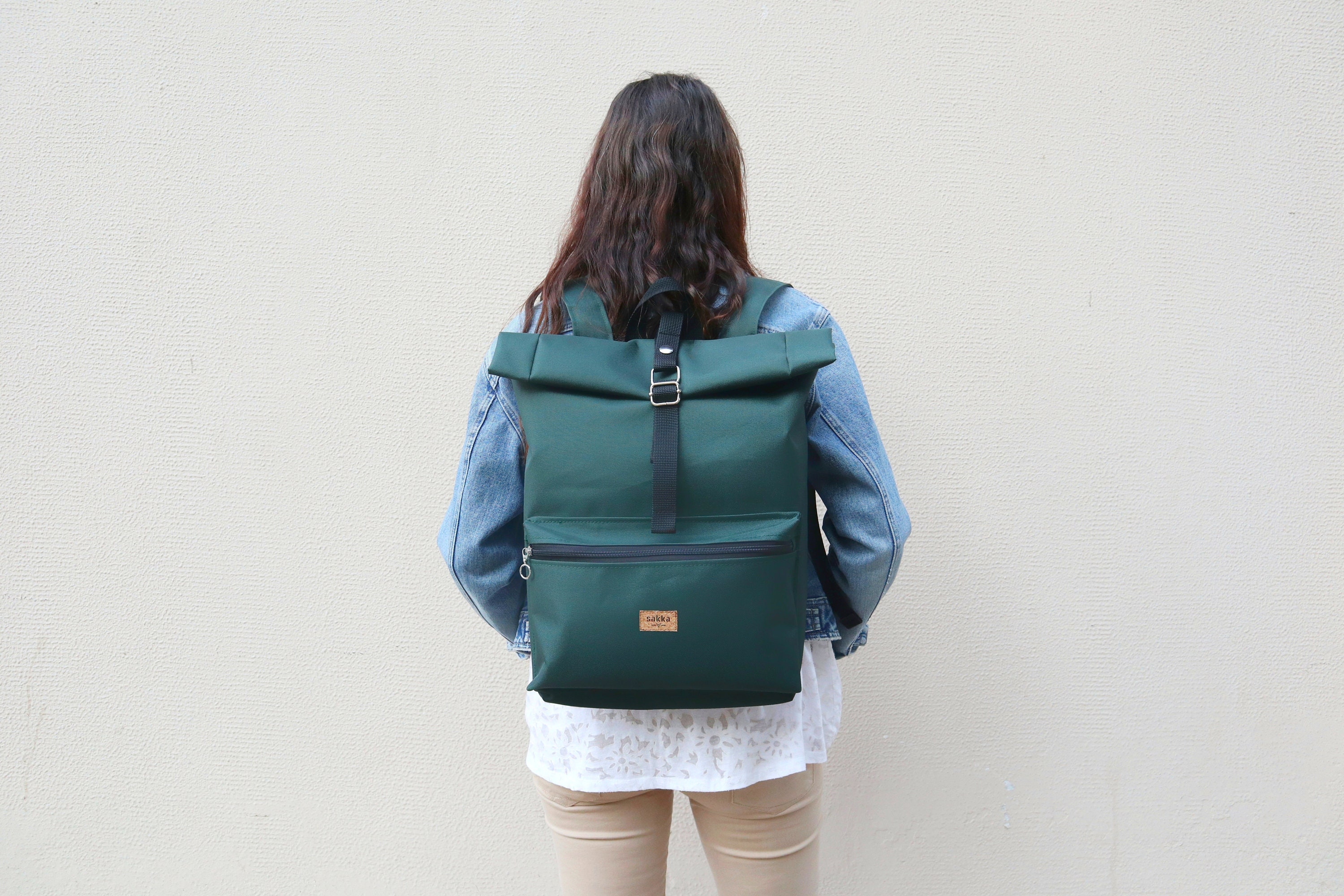 water resistant roll top backpack