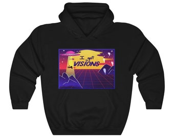 May include: Black hooded sweatshirt featuring a retro-style graphic with a UFO, mountains, and a grid pattern. The graphic includes the text "I got visions" in a stylized font. The design is in shades of purple, yellow, and orange.