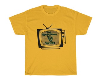 May include: Mustard yellow t-shirt featuring a retro television graphic. The television screen displays the text "THE REVOLUTION WILL NOT BE TELEVISED" in a handwritten style. The shirt is a casual wear item.