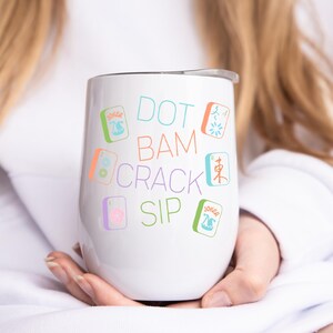 May include: White stainless steel tumbler with a colorful design featuring the text "DOT BAM CRACK SIP" and mahjong tiles.