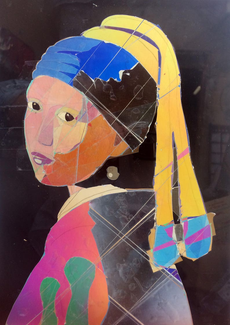 May include: A colorful, abstract portrait of a woman wearing a blue and yellow headscarf. The woman's face is made up of different colored pieces of paper, creating a mosaic effect. The background is black.