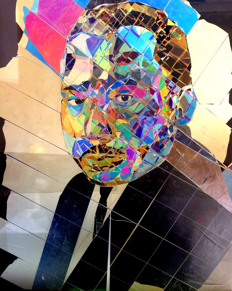 May include: A colorful mosaic portrait of a man with a black suit and a white shirt. The mosaic is made of small pieces of glass and plastic in various colors, including blue, green, red, and yellow.