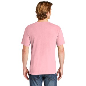 May include: A pink short-sleeved t-shirt made from a soft, comfortable fabric. The shirt has a relaxed fit and a crew neck.