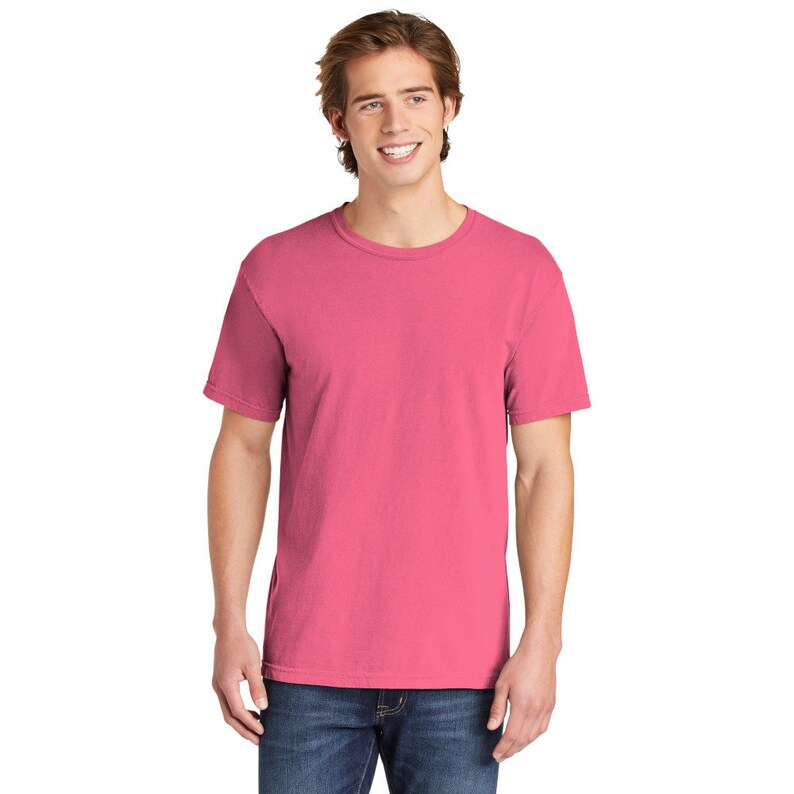 May include: A pink short-sleeved t-shirt with a crew neck.