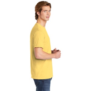May include: A yellow short-sleeved t-shirt with a crew neck.