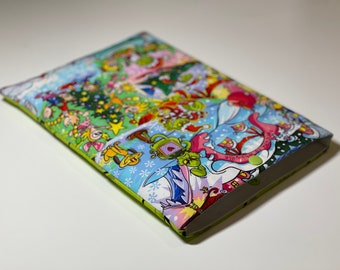 May include: A rectangular, fabric case with a colorful Christmas-themed print. The design features cartoon characters, a Christmas tree, and snowflakes. The case has a lime green border and a green snap closure.