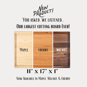The image is an advertisement for a new cutting board, featuring three different types of wood: maple, cherry, and walnut. The text announces that the cutting board is the largest cutting board ever, and it is now available in these three wood types.