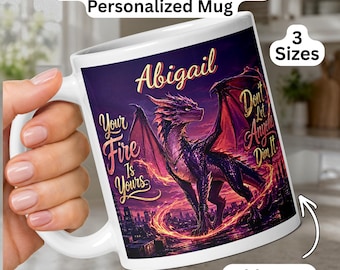 May include: A white ceramic mug featuring a purple and orange dragon illustration against a dark city background. The text reads Abigail, Your Fire Is Yours, and Don't Let Anyone Dim It. The mug includes labels for Purple Orange Fire Dragon Personalized Mug and 3 Sizes.