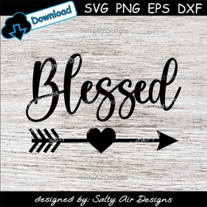 May include: Black and white graphic design with the word "Blessed" in a cursive font. An arrow with a heart in the middle points to the right. The design is on a woodgrain background.