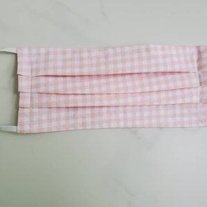 Cotton face mask with filter pocket and elastics