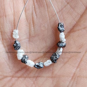 May include: A set of three ceramic mugs with a speckled, matte finish. Each mug features a different color: light blue, cream, and gray. The mugs have a simple, modern design, perfect for coffee or tea.