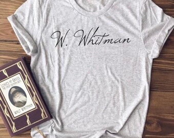 May include: A grey t-shirt with the text "W. Whitman" printed in black on the front.